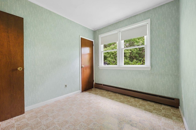 65 Hortontown Rd, Carmel, NY 10512 - unfurnished room featuring a baseboard radiator, tile patterned floors, and wallpapered walls