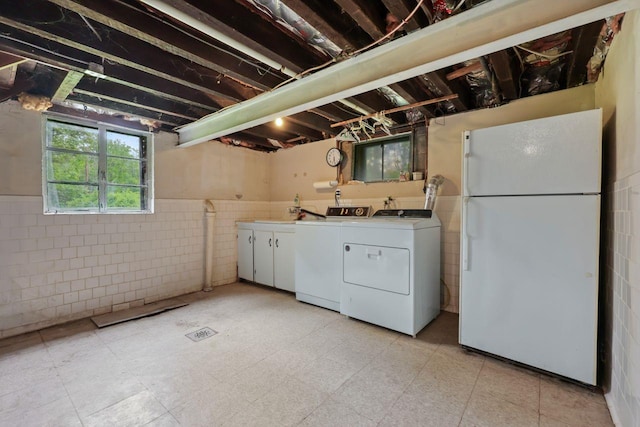 65 Hortontown Rd, Carmel, NY 10512 - washroom with washer and clothes dryer, cabinet space, wainscoting, and tile walls