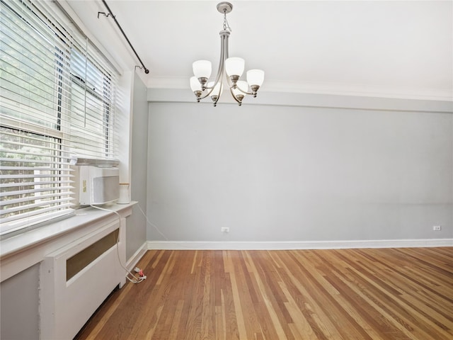 90 Bryant Ave Unit 3Da, White Plains, NY 10605 - unfurnished dining area featuring light wood finished floors, a chandelier, and crown molding