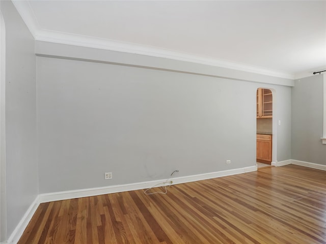 90 Bryant Ave Unit 3Da, White Plains, NY 10605 - unfurnished room featuring arched walkways, crown molding, and light wood-style flooring