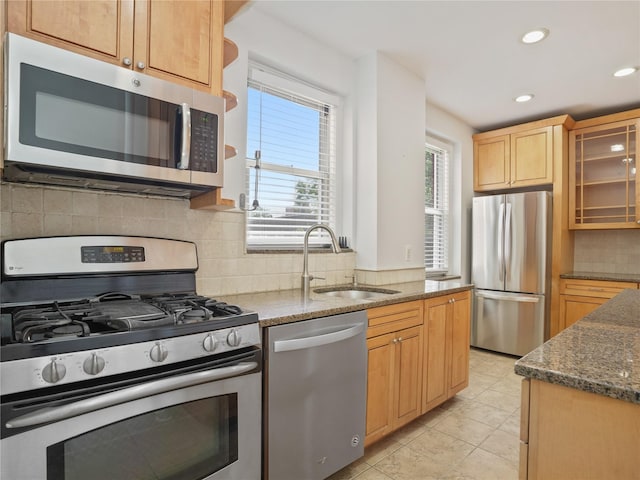 90 Bryant Ave Unit 3Da, White Plains, NY 10605 - kitchen with appliances with stainless steel finishes, recessed lighting, decorative backsplash, dark stone countertops, and glass insert cabinets