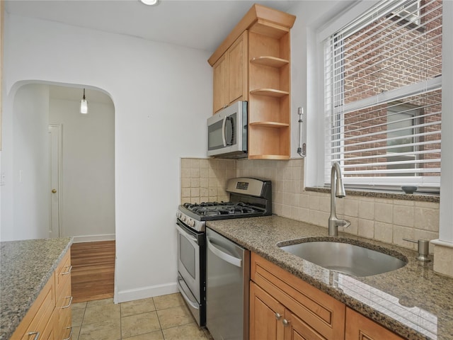 90 Bryant Ave Unit 3Da, White Plains, NY 10605 - kitchen featuring stainless steel appliances, open shelves, decorative backsplash, and plenty of natural light