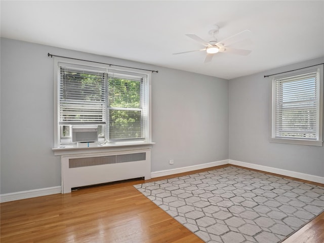 90 Bryant Ave Unit 3Da, White Plains, NY 10605 - empty room featuring radiator, plenty of natural light, wood finished floors, and a ceiling fan