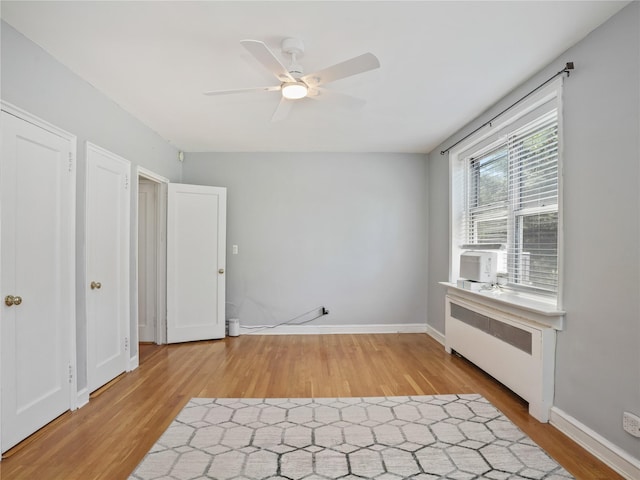 90 Bryant Ave Unit 3Da, White Plains, NY 10605 - unfurnished room featuring light wood-style floors, a ceiling fan, radiator heating unit, and cooling unit