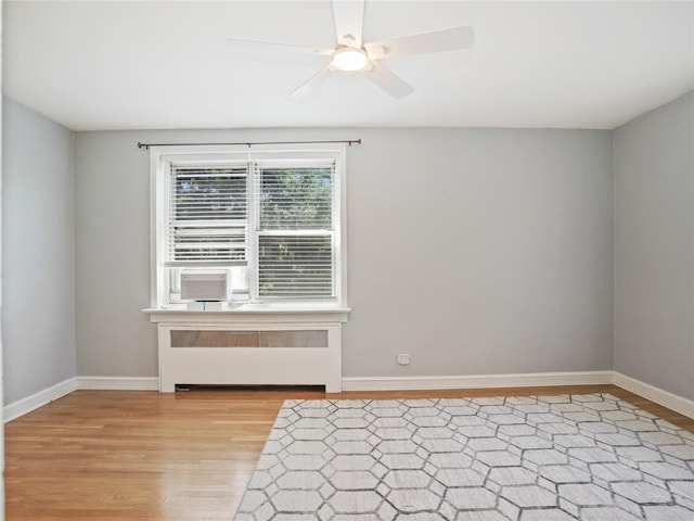 90 Bryant Ave Unit 3Da, White Plains, NY 10605 - empty room featuring radiator, light wood-style flooring, and ceiling fan