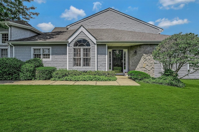64 Lakebridge Dr S Unit 64, Kings Park, NY 11754 - back of house featuring a lawn and a shingled roof