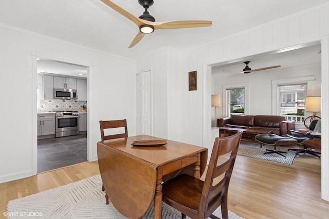 65 Union St, Beacon, NY 12508 - dining space featuring a ceiling fan, ornamental molding, and dark wood-type flooring