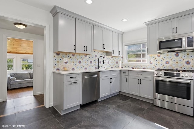 65 Union St, Beacon, NY 12508 - kitchen with appliances with stainless steel finishes, gray cabinets, healthy amount of natural light, light countertops, and recessed lighting