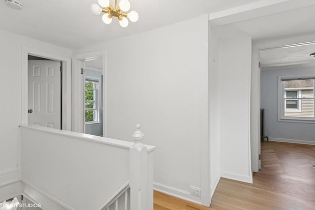 65 Union St, Beacon, NY 12508 - corridor with an upstairs landing, plenty of natural light, a chandelier, and parquet floors
