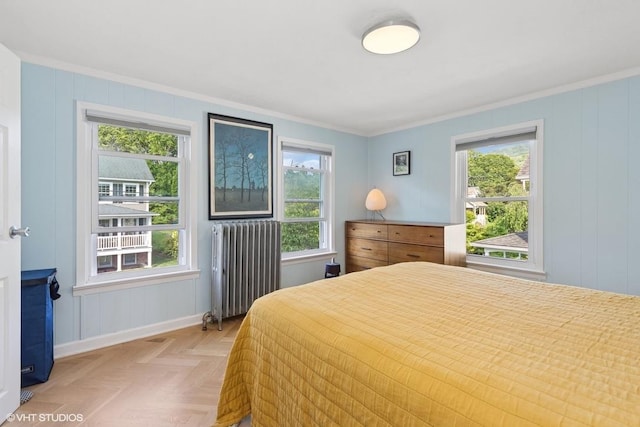 65 Union St, Beacon, NY 12508 - bedroom featuring radiator, ornamental molding, multiple windows, and a decorative wall