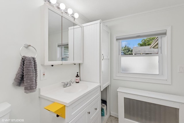 65 Union St, Beacon, NY 12508 - half bathroom with radiator, ornamental molding, and vanity