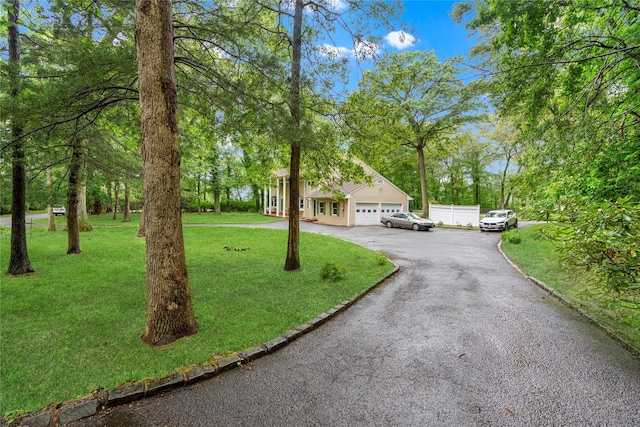 5 Linda Ct, Oyster Bay, NY 11771 - view of front of property with asphalt driveway and a garage