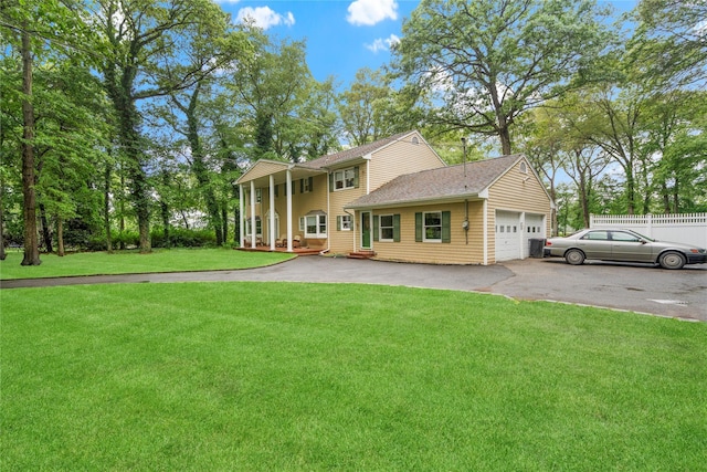 5 Linda Ct, Oyster Bay, NY 11771 - neoclassical home with asphalt driveway and a garage