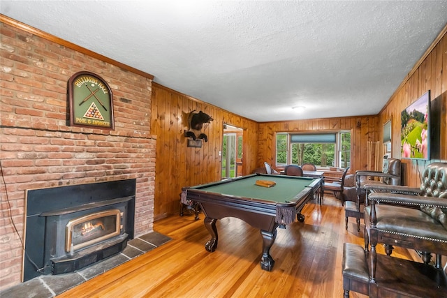 5 Linda Ct, Oyster Bay, NY 11771 - game room featuring wood walls, a textured ceiling, hardwood / wood-style floors, billiards table, and a fireplace