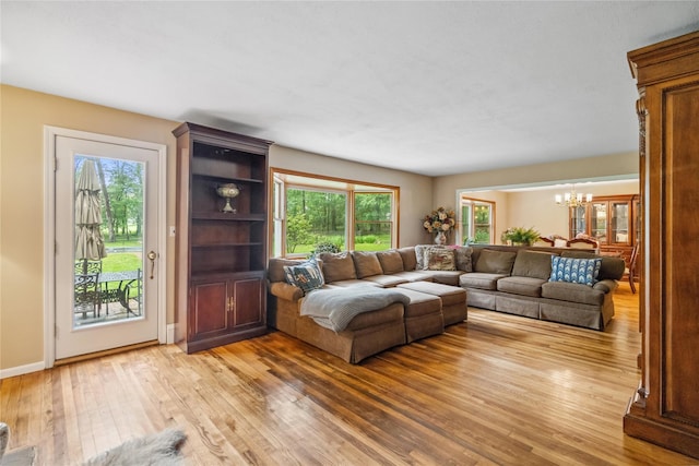 5 Linda Ct, Oyster Bay, NY 11771 - living room with a chandelier and light wood-style floors