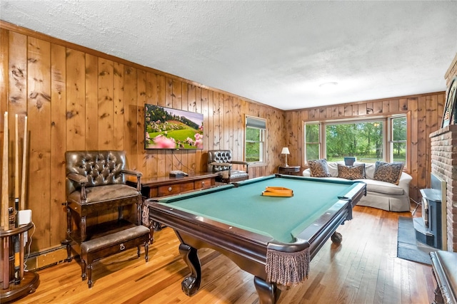 5 Linda Ct, Oyster Bay, NY 11771 - playroom featuring a textured ceiling, hardwood / wood-style floors, wood walls, and billiards table