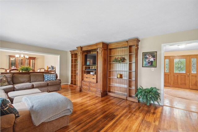 5 Linda Ct, Oyster Bay, NY 11771 - living room with a chandelier and wood finished floors