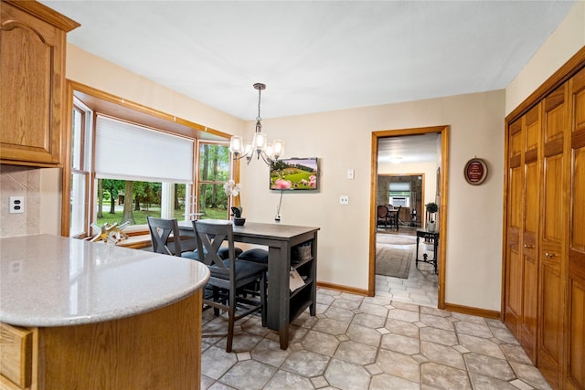 5 Linda Ct, Oyster Bay, NY 11771 - dining area with plenty of natural light and a chandelier
