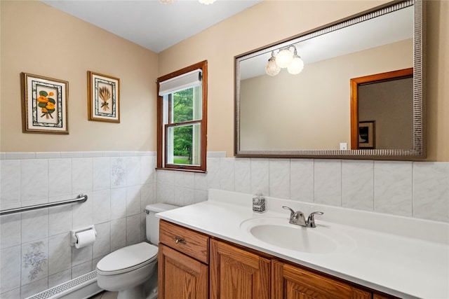 5 Linda Ct, Oyster Bay, NY 11771 - bathroom featuring vanity, a baseboard heating unit, tile walls, and a wainscoted wall