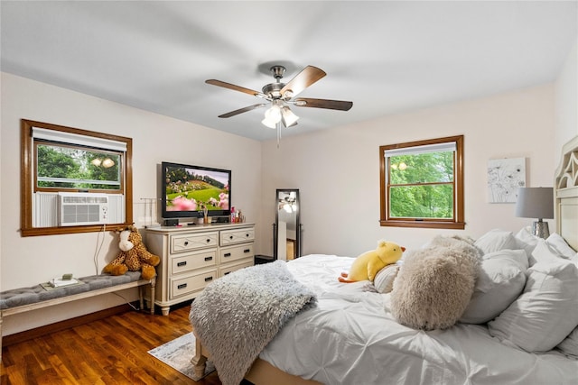 5 Linda Ct, Oyster Bay, NY 11771 - bedroom featuring multiple windows, dark wood-type flooring, cooling unit, and ceiling fan