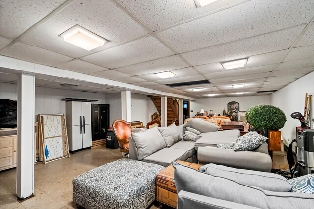 5 Linda Ct, Oyster Bay, NY 11771 - living room featuring a drop ceiling, stairway, and light flooring