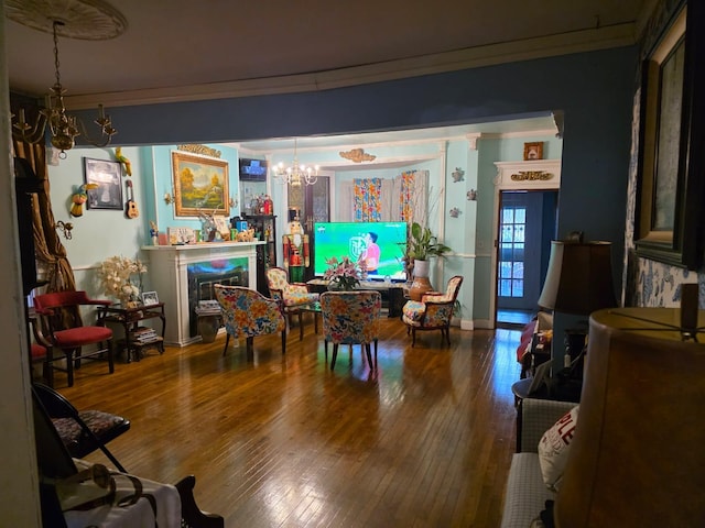3318 104th St, Corona, NY 11368 - living room featuring a chandelier, ornamental molding, hardwood / wood-style floors, and a glass covered fireplace