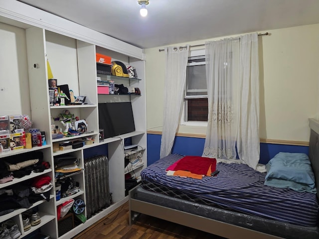 3318 104th St, Corona, NY 11368 - bedroom featuring wood finished floors