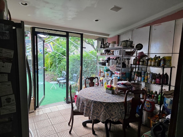 3318 104th St, Corona, NY 11368 - dining room with light tile patterned floors and recessed lighting
