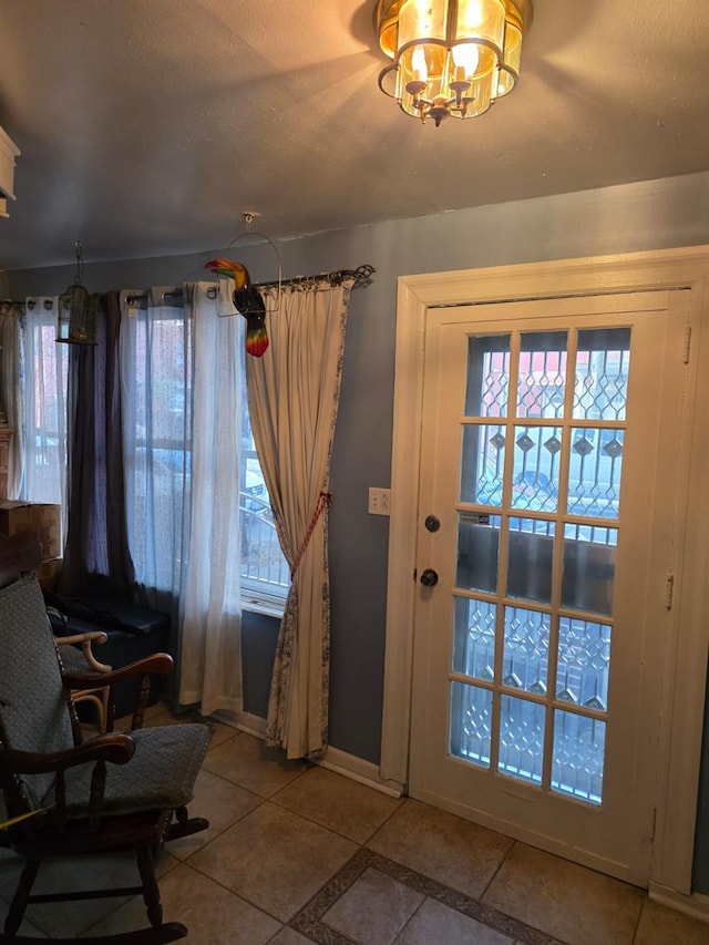 3318 104th St, Corona, NY 11368 - doorway with tile patterned floors and a chandelier