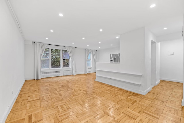5425 Valles Ave Unit 1L, Bronx, NY 10471 - unfurnished living room featuring radiator and recessed lighting