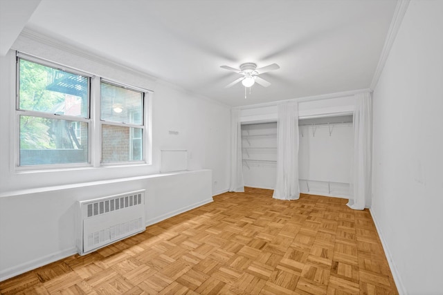 5425 Valles Ave Unit 1L, Bronx, NY 10471 - unfurnished bedroom featuring radiator, two closets, ornamental molding, and ceiling fan