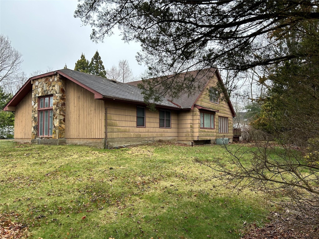 6 Cedarfield Ter, Setauket, NY 11780 - view of property exterior featuring a lawn and roof with shingles