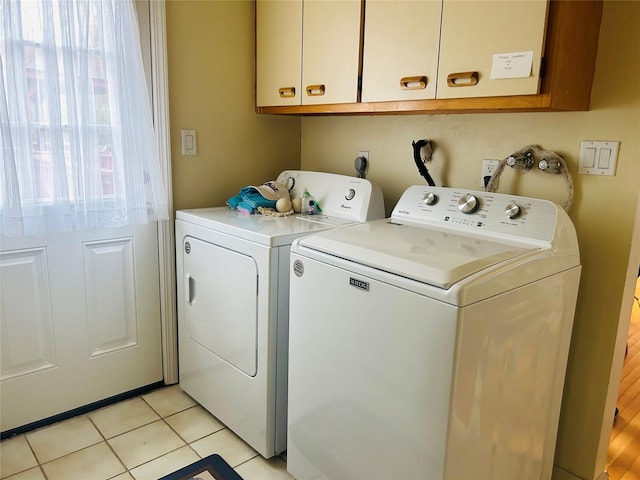 6 Cedarfield Ter, Setauket, NY 11780 - laundry area featuring separate washer and dryer, cabinet space, and light tile patterned flooring