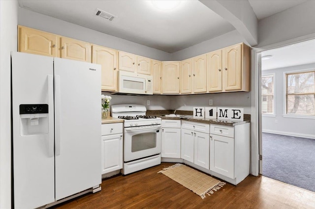 748 Georgia Ave, Brooklyn, NY 11207 - kitchen featuring white appliances, dark wood-style floors, and dark countertops