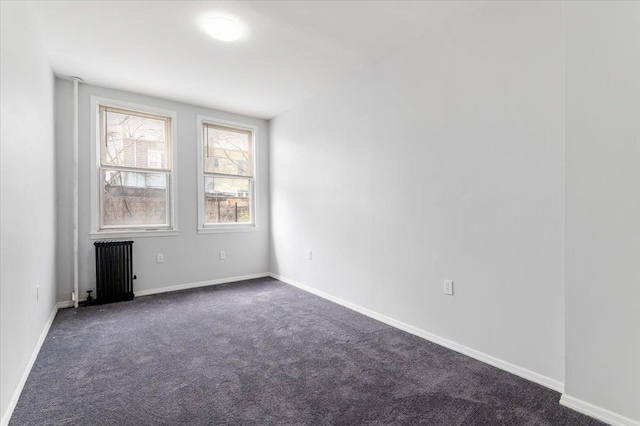 748 Georgia Ave, Brooklyn, NY 11207 - spare room featuring radiator and dark carpet