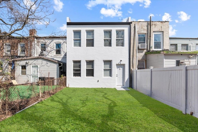 748 Georgia Ave, Brooklyn, NY 11207 - back of property with stucco siding, a fenced backyard, and cooling unit