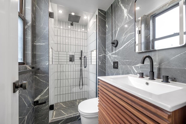 4705 Henry Hudson Pkwy W Unit 6J, Bronx, NY 10471 - bathroom featuring tile walls, a shower stall, vanity, recessed lighting, and marble finish floors