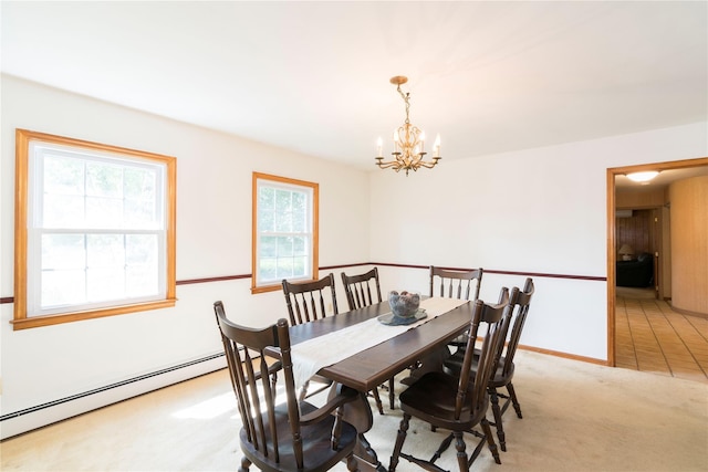 4 Pasture Ln, Poughkeepsie, NY 12603 - dining room with a baseboard radiator, a chandelier, and light carpet