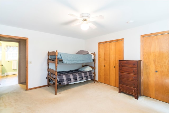 4 Pasture Ln, Poughkeepsie, NY 12603 - bedroom with light carpet, a ceiling fan, multiple closets, and a baseboard heating unit