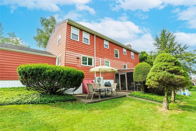 4 Pasture Ln, Poughkeepsie, NY 12603 - back of property with a sunroom, a lawn, and a patio area