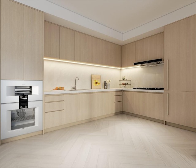133-25 37th Ave Unit 3C, Flushing, NY 11354 - kitchen with light brown cabinetry, modern cabinets, under cabinet range hood, and light countertops