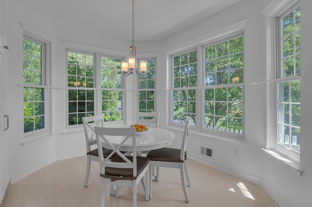 18 Tall Tree Cir, Jamesport, NY 11901 - sunroom / solarium featuring a chandelier and healthy amount of natural light
