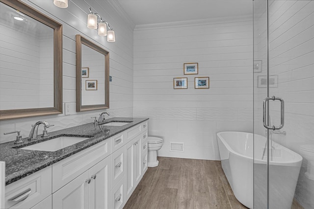 18 Tall Tree Cir, Jamesport, NY 11901 - bathroom featuring wood finished floors, double vanity, a freestanding bath, and ornamental molding