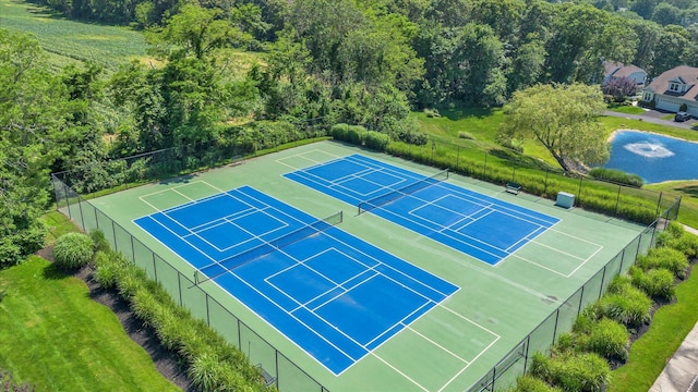 18 Tall Tree Cir, Jamesport, NY 11901 - view of tennis court featuring a view of trees