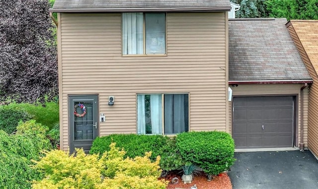 18 Larch Ct, Fishkill, NY 12524 - view of front of property with asphalt driveway and an attached garage