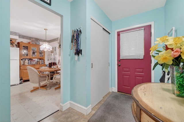 114 Halgren Cres, Haverstraw, NY 10927 - entryway featuring a chandelier and baseboards