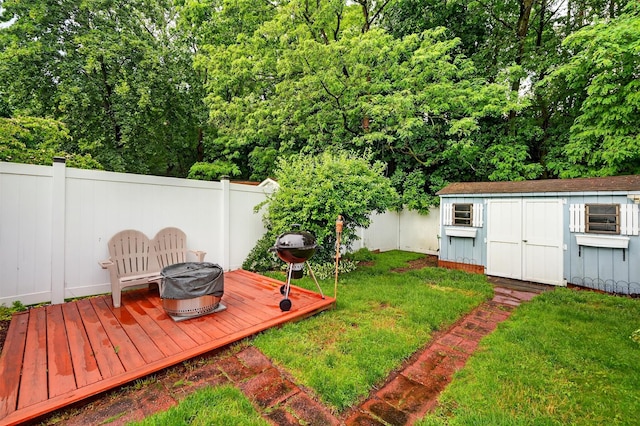 114 Halgren Cres, Haverstraw, NY 10927 - fenced backyard with a wooden deck, a shed, and an outdoor fire pit