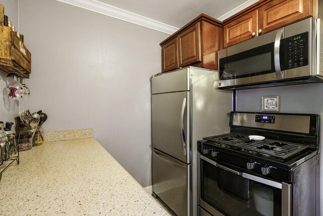 520 Tuckahoe Rd Unit 3B, Yonkers, NY 10710 - kitchen with stainless steel appliances, ornamental molding, light stone countertops, and brown cabinets