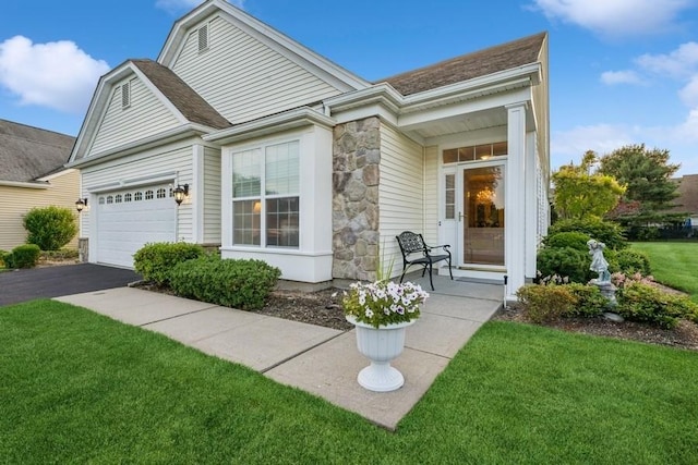 15 Louden Loop, Mount Sinai, NY 11766 - view of front facade with stone siding, a front lawn, asphalt driveway, an attached garage, and a shingled roof