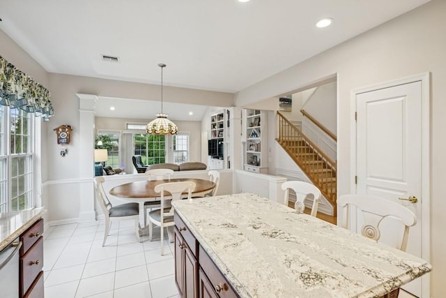 15 Louden Loop, Mount Sinai, NY 11766 - kitchen featuring recessed lighting, decorative light fixtures, light stone countertops, light tile patterned floors, and a chandelier